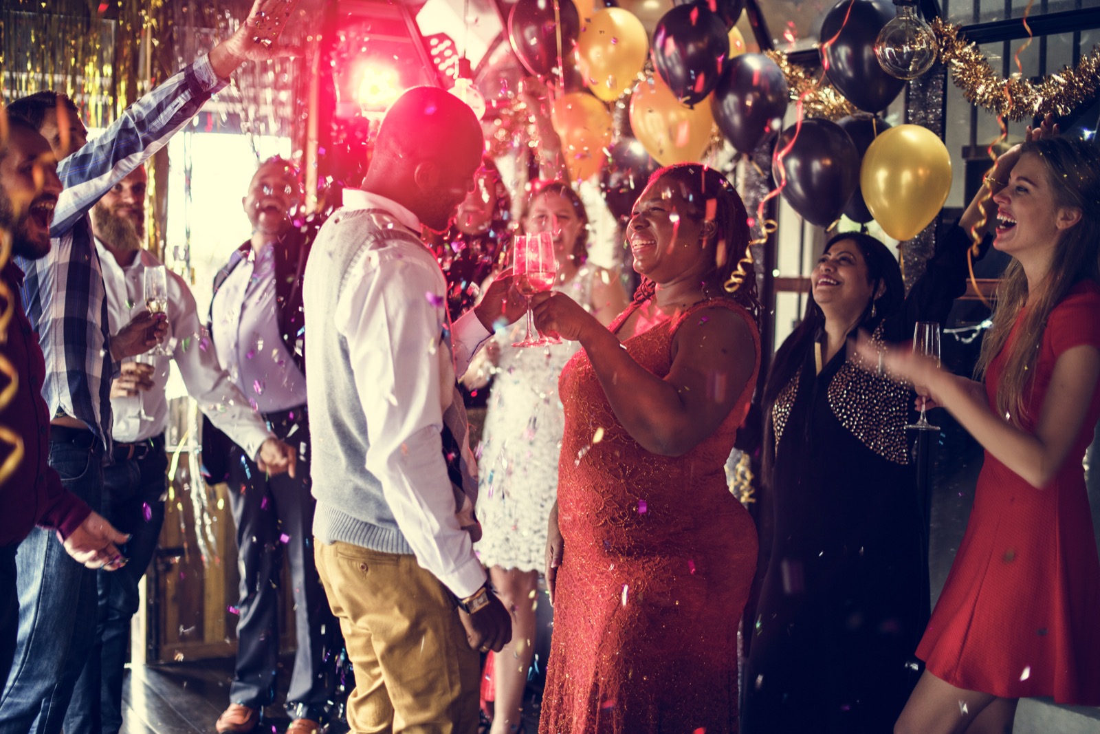 Friends dancing together at an energetic private party