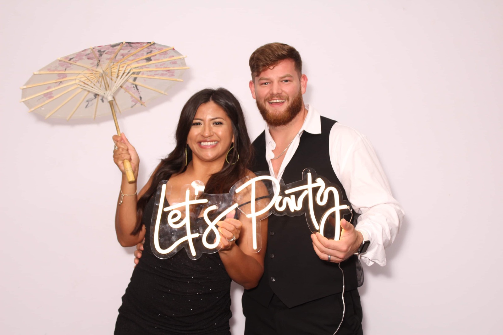 Guests posing together at a lively private-party photo experience
